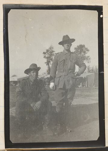 Two soldiers at an army camp.