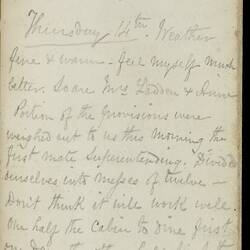 Open diary with handwritten text on discoloured worn page.