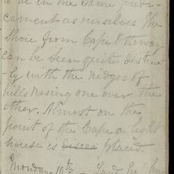 Open diary with handwritten text on discoloured worn page.