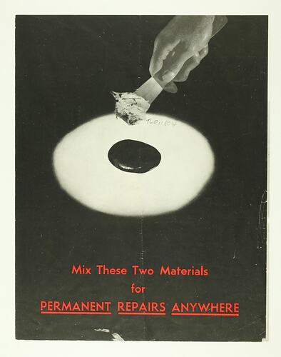 Front cover image with black and white adhesive.