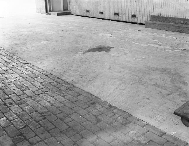Monochrome photograph of a floor.