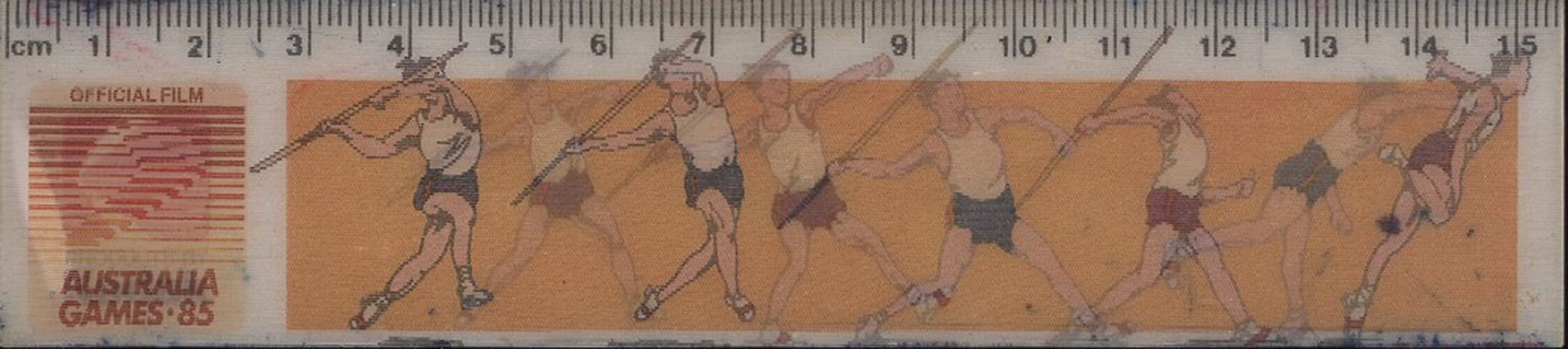 Plastic ruler with "holographic" drawing of javelin thrower.