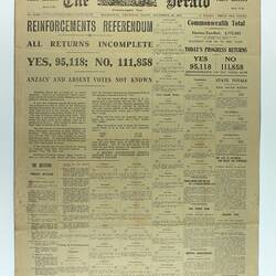 Newspaper page with black printed text on yellow paper.