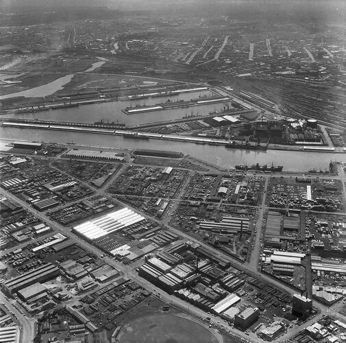 Monochrome aerial image of a shipping dock.