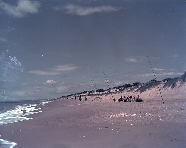 Colour transparency of a crowd on a beach.