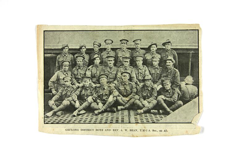 Newspaper cutting with group portrait of soliders.