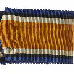 Ribbon with orange, blue and white stripes.