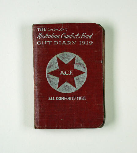 Front cover of red and silver diary with star motif.