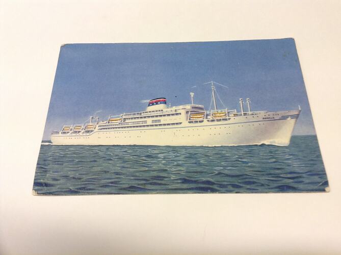 Postcard featuring photograph of ship at sea.