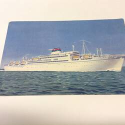 Postcard featuring photograph of ship at sea.