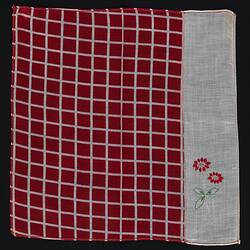 Red and White unfolded handkerchief with embroidered flowers.