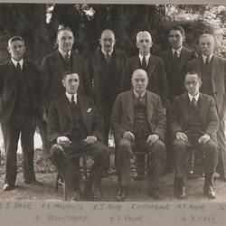 Black and white photograph of an executive group.