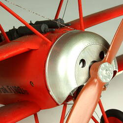 Red aeroplane model. Propeller detail.