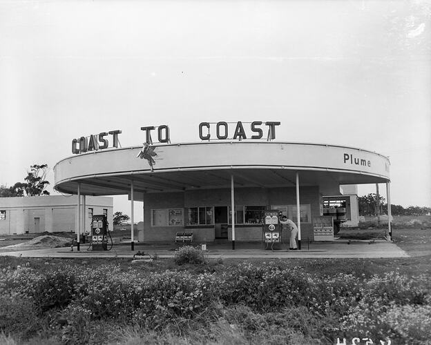 Petrol station with curved roofline.
