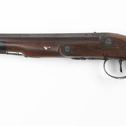 Duelling pistol, wooden with octagonal barrel, oval trigger guard.