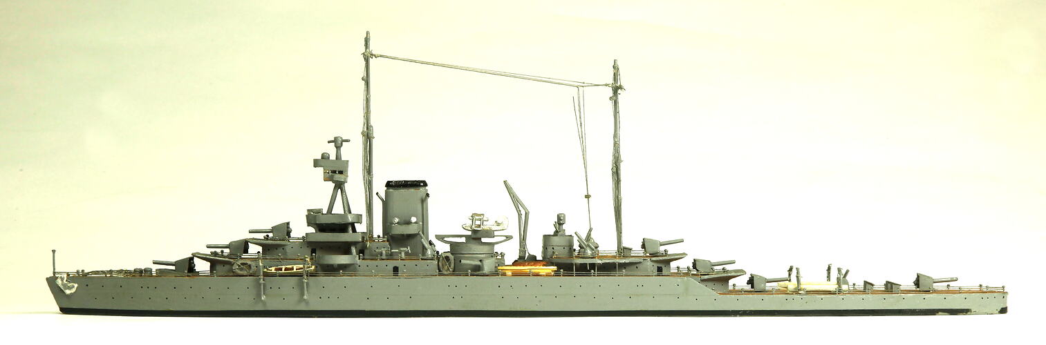 Naval ship with two masts, facing left.