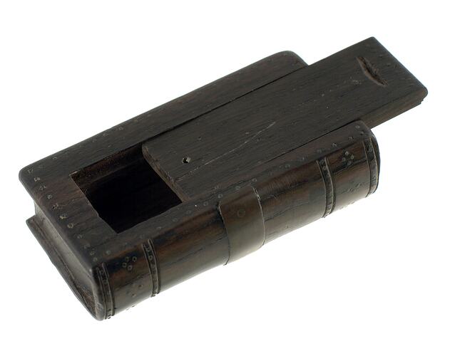 Dark wooden snuff box with sliding lid. Open.