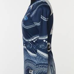 Women's AFLW guernsey with Indigenous pattern in navy and white. Lined and dotted design.