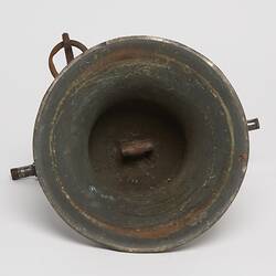 Underside of metal bell.