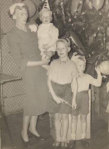 Digital Photograph - Woman with Three Sons, Commonwealth Aircraft Corporation Christmas Party, Port Melbourne, 1955