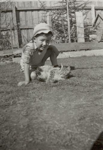 Digital Photograph - Boy in Hat, Playing with Cat, Backyard, Pascoe Vale, 1956
