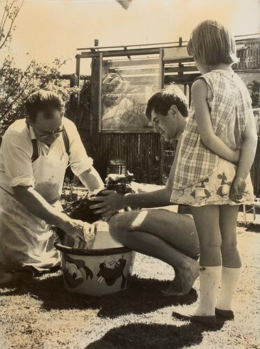 Digital Photograph - Two Men & Girl Washing Small Dog, Backyard, Caulfield, 1968