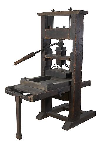 Wooden standing printing press with movable tray.
