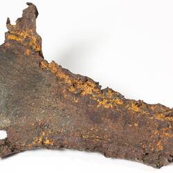 Irregular shaped piece of corroded iron.