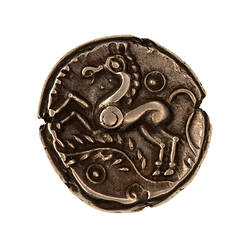 Coin, round, Horse leaping left above palm branch with ring ornaments above, below and on the horses shoulder.