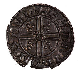 Coin, round, short cross voided below small quadrilateral with curved arma and trefoils at its points.