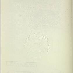 White passport page with black printing. Stamped.
