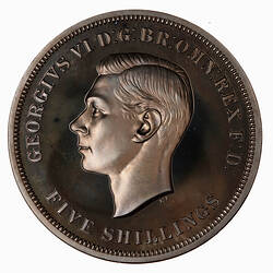 Coin with left facing profile of George VI. Text around.