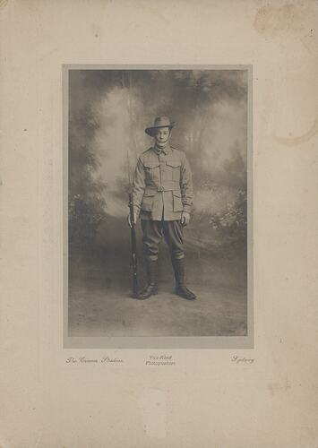 Uniformed soldier in studio.