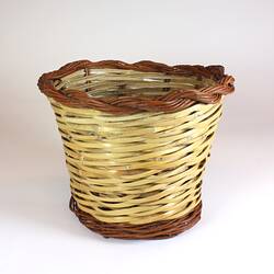 Woven cane basket in two colours.