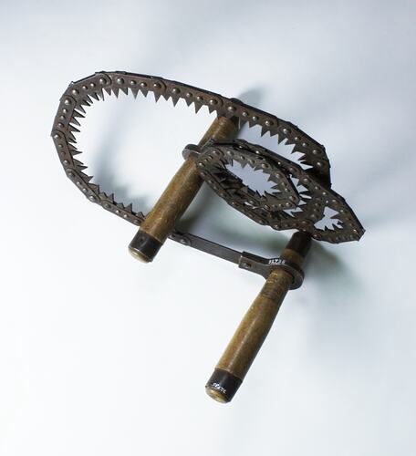 Metal folding saw, two wood handles.
