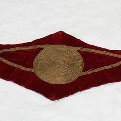 Child's wide scalloped edged red velvet belt with gold cord central circle and detail.