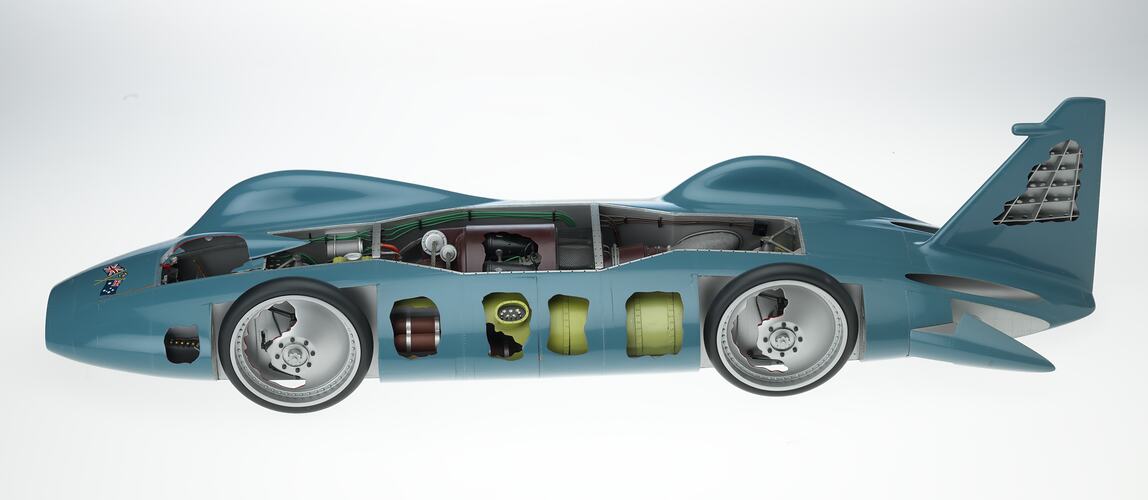 Blue model car with sectioned areas showing the internal components. Left profile.