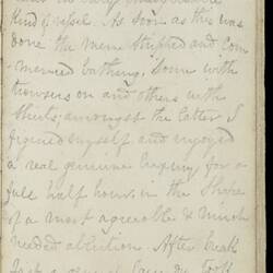 Open diary with handwritten text on discoloured worn page.