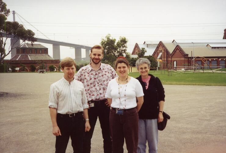Four people posed outdoors at Scienceworks museum.
