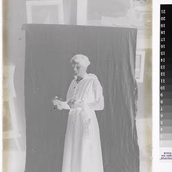 Woman Against Studio Backdrop, circa 1910s