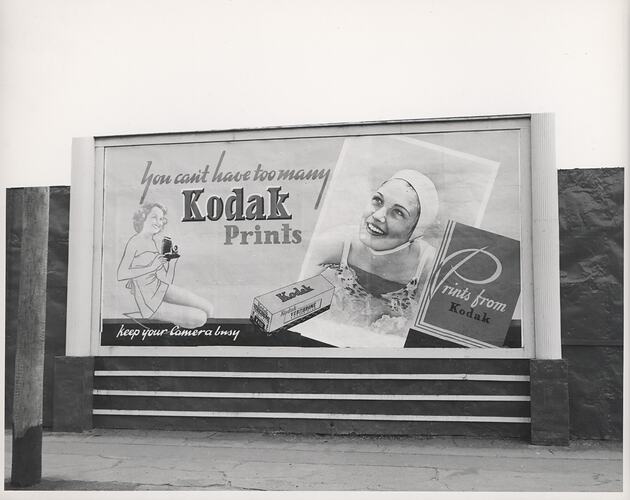 Kodak billboard with telegraph pole and footpath