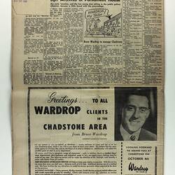 Back of newspaper with text and photo of man in advertisement