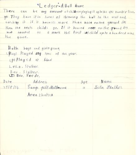 Handwritten game description in blue ink on paper