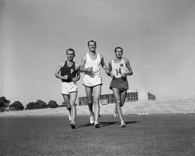 Shell Co, Three Men Running Across an Oval, Olympic Park, Melbourne, 08 Feb 1960