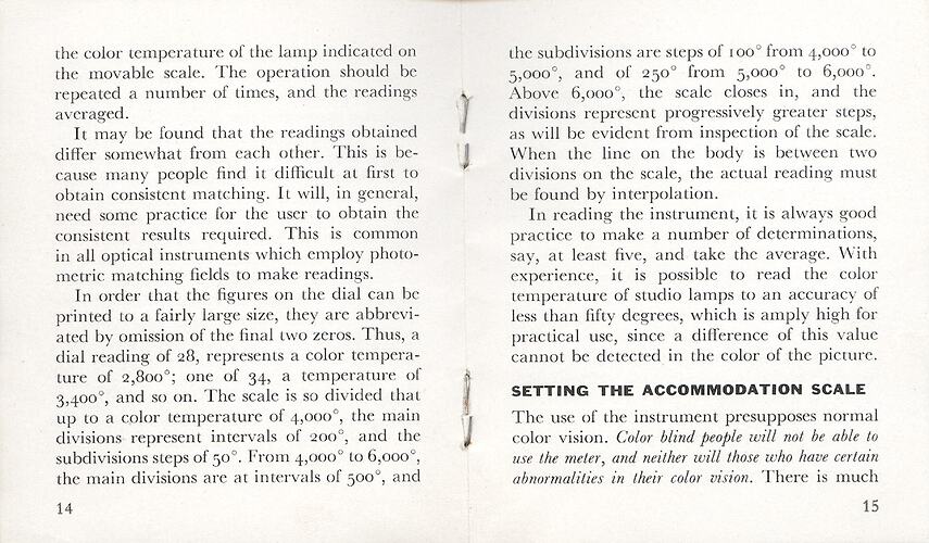 Open booklet with printed text and stapled spine.