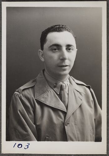 Studio portrait of man in military uniform.