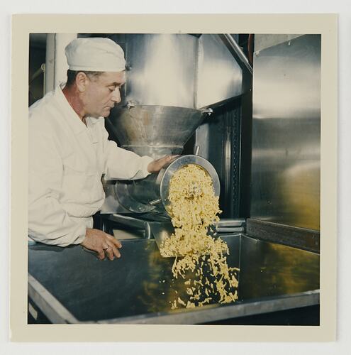 Slide 143, Worker Mincing Hardened Emulsion, Kodak Factory, Coburg, 'Extra Prints of Coburg Lecture' album, circa 1960s