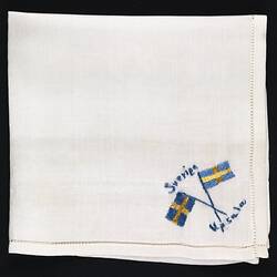 Folded silk handkerchief with flag of Sweden.