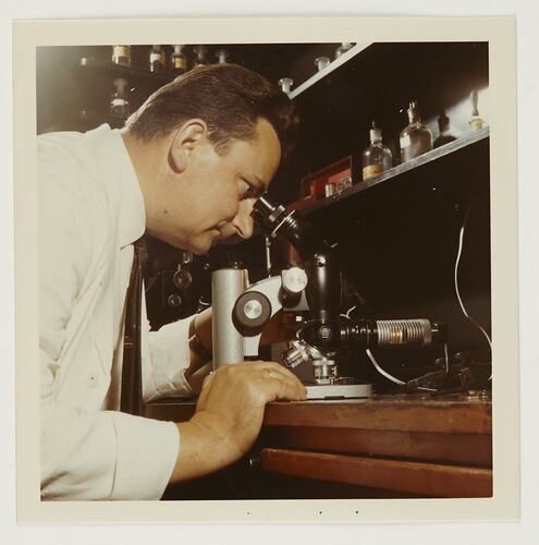 Slide 189, 'Extra Prints of Coburg Lecture', Worker Looking Through Microscope, Kodak Factory, Coburg, circa 1960s