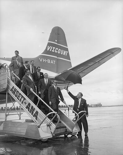 Ansett-ANA, Group of Men Disembarking Aeroplane, Essendon Airport, Victoria, Nov 1958